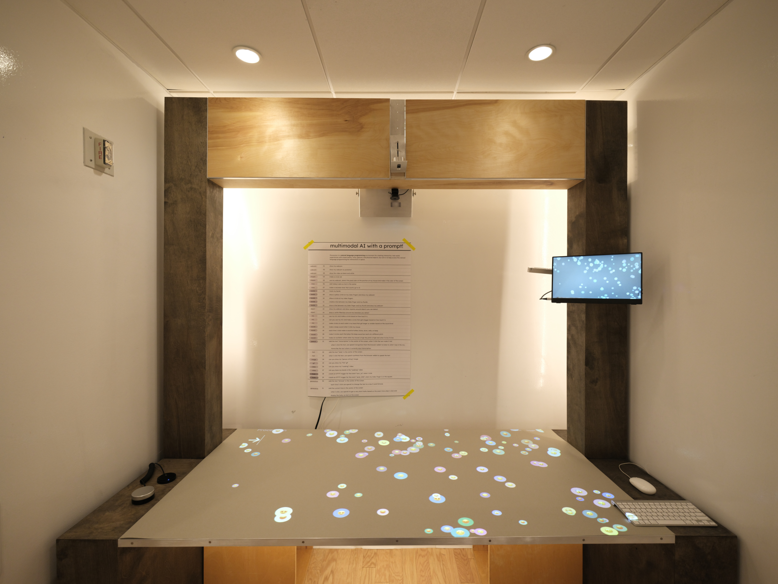 The Spatial Pixel Lab showing a tabletop projection with a bubble emoji interface and warm glowing backlight.