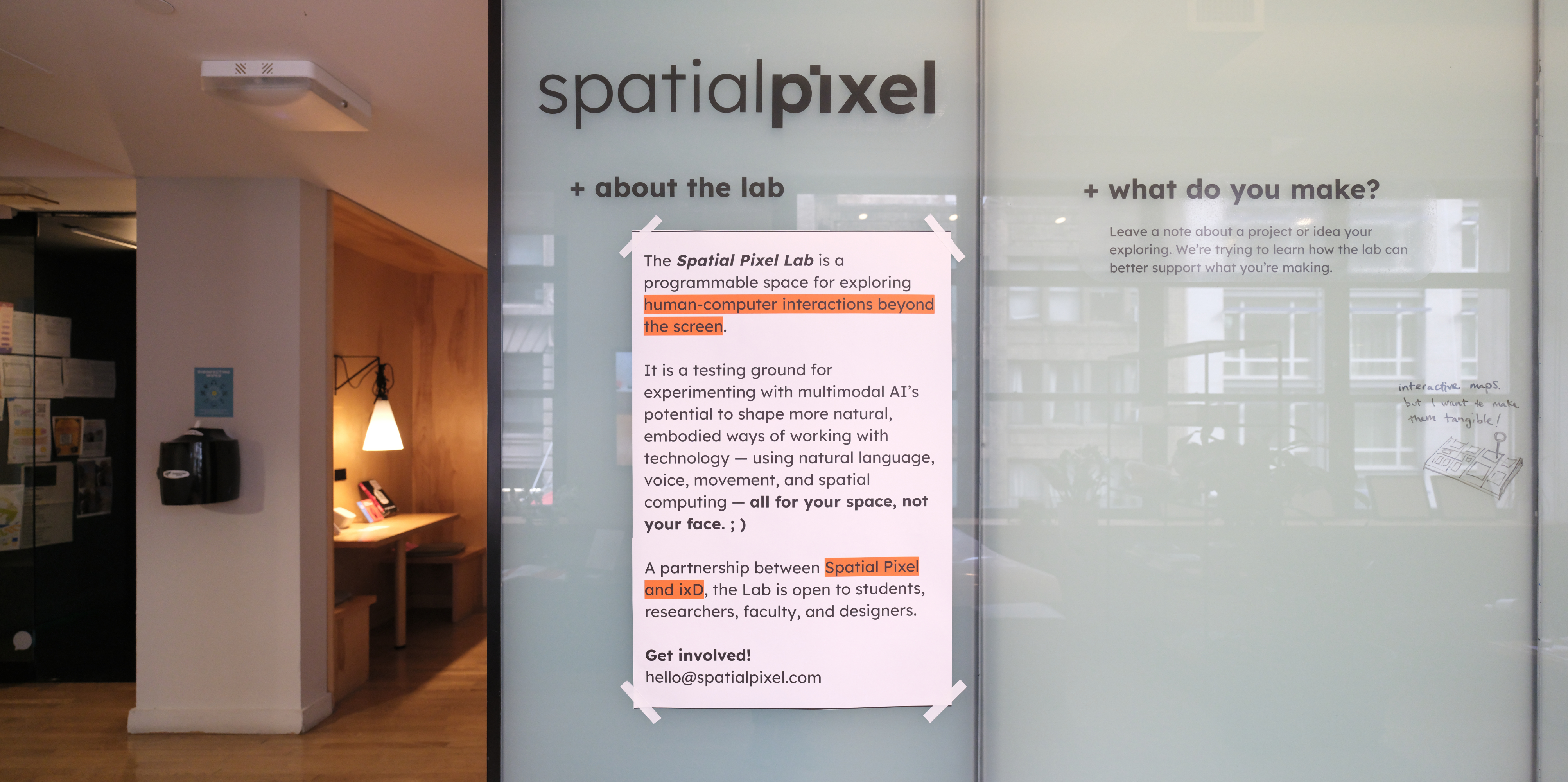 The lobby of the SVA interaction design program space with a poster describing the Spatial Pixel Lab.